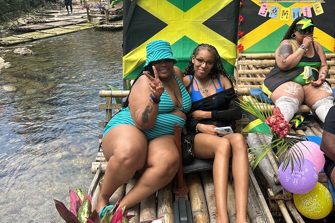 Bamboo Rafting and Limestone Foot Massage from Montego Bay - Meeting the bamboo raft on calm Jamaican water