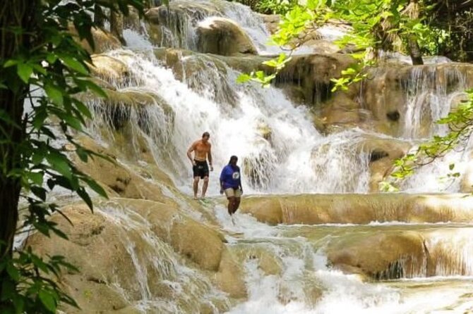 Dunn's River Falls + Bamboo Rafting With Limestone Foot Massage - One hour on a 50-foot bamboo raft