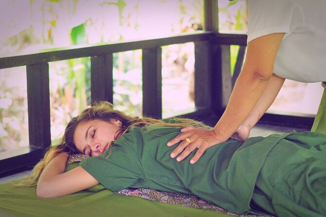 Full-day Massage and Hot Spring Spa Package in Krabi - Warm herbal cloth treatment for the neck and shoulders
