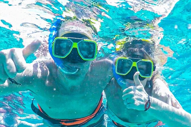 Luxury Cozumel Catamaran: Snorkel, Beach Club & Relaxation - Guided snorkeling in Cozumel’s clear water